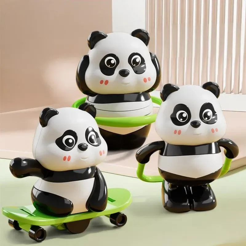 Three panda-shaped toys on a light surface with a neutral background